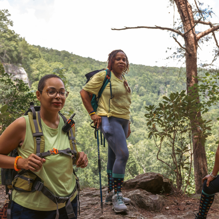 6 3 women pose for a candid photo mid-hike